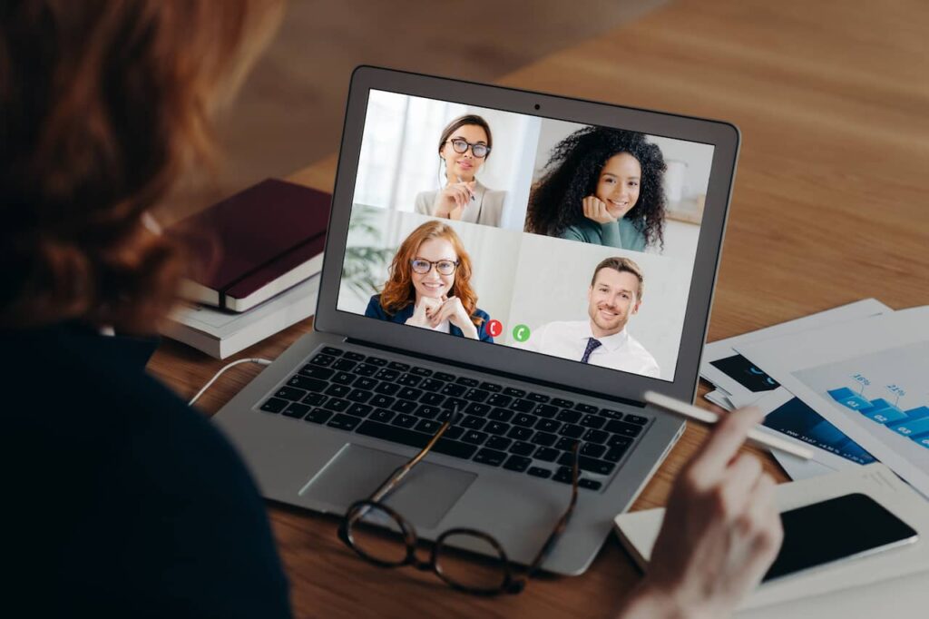 Virtual conference being displayed on laptop computer.